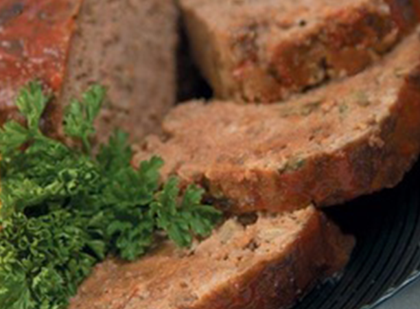 Close-up of a serving of meatloaf.